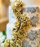 Floral Wedding Cake with Gold Flowers
Photography: Heather Rowland Photography %26 Thisbe Grace Photography
Read More:
http://www.insideweddings.com/weddings/gorgeous-blue-white-gold-wedding-with-lush-greenery-in-texas/1107/ wedding cake with blue and white ombre flower design and gold sugar flowers down side