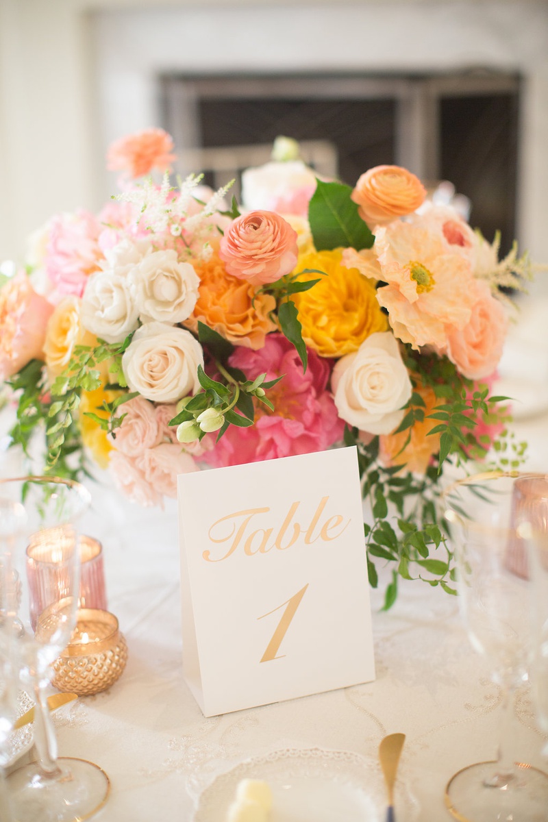 Gold Table Number at Ballroom Reception
Photography: Ashley Paige Photography
Read More:
http://www.insideweddings.com/weddings/romantic-ocean-view-ceremony-charming-reception-in-california/1337/ wedding table number gold card pink yellow orange flowers rose peony ranunculus greenery