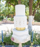 Cake with Metallic Details
Photography: Fully Alive Photography
Read More:
http://www.insideweddings.com/weddings/roaring-twenties-garden-party-inspirational-wedding-shoot/1230/ 1920s inspired styled shoot white wedding cake with metallic details