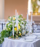 Sweetheart Table with Gold Taper Candles
Photography: Willa Kveta Photography
Read More:
http://www.insideweddings.com/weddings/destination-wedding-in-santa-barbara-with-california-sunshine-theme/1310/ wedding reception sweetheart table taper candle gold candleholder greenery white yellow flowers