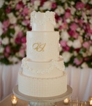 Elegant Monogram Cake
Photography: Adrienne Page
Read More:
http://www.insideweddings.com/weddings/pink-and-white-destination-wedding-in-charleston-south-carolina/542/ White wedding cake with classic piping and gold monogram