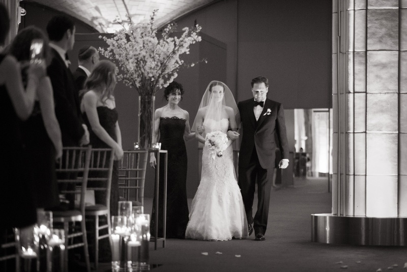 Black and White Photo of Bride Walking with Parents
Photography: Ira Lippke Studios
Read More:
http://www.insideweddings.com/weddings/chic-classic-new-york-city-wedding-with-personal-touches/783/ black and white photo of a bride walking down the aisle lead by her parents