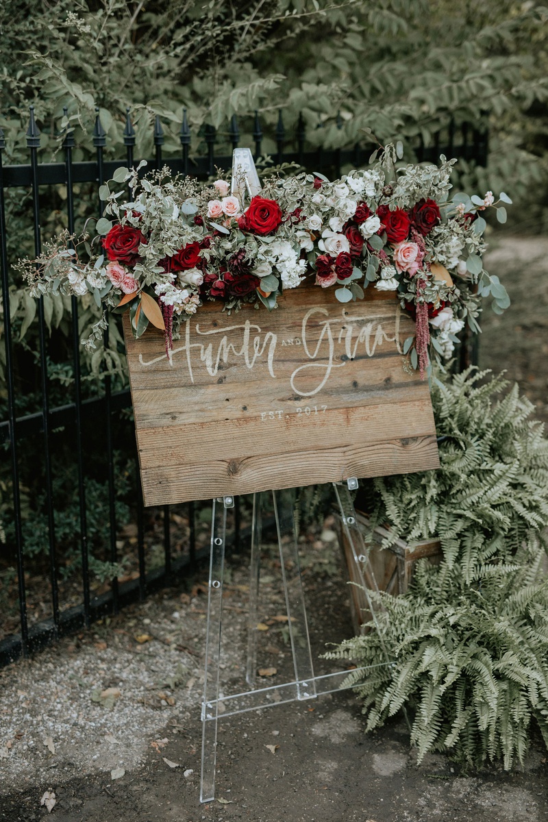 Reclaimed Wood Sign on Acrylic Stand
Photography: Grant Daniels Photography
Read More:
http://www.insideweddings.com/weddings/outdoor-ceremony-tented-reception-with-cozy-fall-color-palette/1183/ wedding reception welcome sign wood sign on clear lucite stand burgundy flowers greenery amaranthus