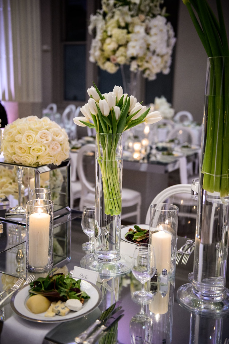 Dinner Served at Mirror Table
Photography: Chris Bailey Photography
Read More:
http://www.insideweddings.com/weddings/modern-elegant-ballroom-wedding-with-white-flowers-in-houston/1246/ wedding reception table salad course dinner candles white tulips in vase white rose flowers