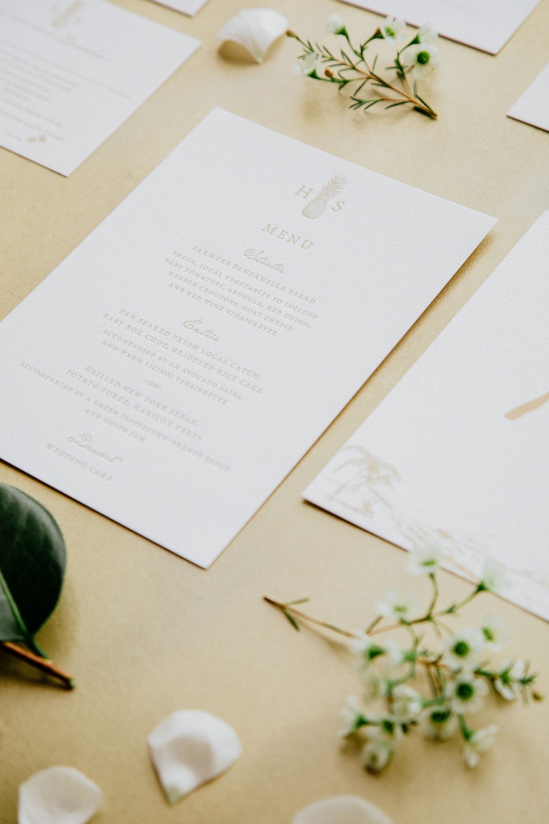 Wedding Menu with Pineapple Monogram
Photography: Chris J. Evans Photography
Read More:
http://www.insideweddings.com/weddings/outdoor-winter-ceremony-and-reception-on-the-big-island-in-hawaii/1306/ wedding stationery suite paper goods white gold details menu card with selections and pineapple