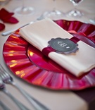 Crimson Charger with Wavy Ridges
Photography: Lindsay Muciy Photography
Read More:
http://www.insideweddings.com/weddings/vibrant-florals-dramatic-details-at-montreal-wedding/918/ red charger with wavy ridges on edge, cream napkin with scarlet velvet ribbon