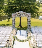 Floral Arch at Dallas Club Venue
Photography: Karlisch Photography
Read More:
http://www.insideweddings.com/weddings/luxury-hotel-wedding-with-personalized-elements-in-dallas-texas/1119/ Wedding ceremony outside white aisle runner shepherd hook flower garland flowers along aisle arch