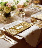 Golden Place Setting
Photography: Liz Banfield and Adrienne Page
Read More:
http://www.insideweddings.com/weddings/glittering-gold-new-years-eve-celebration-in-oklahoma-city/614/ Gold velvet name card with monogram napkin at reception