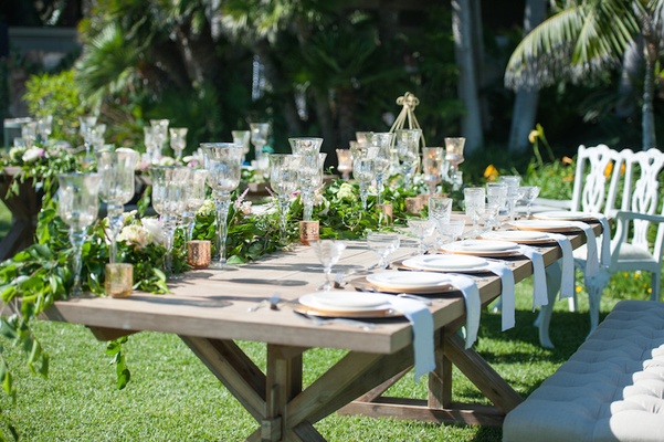 Garden Wedding Reception With Rustic Wood Table Greenery White Flowers Glass Candleholders Garden Wedding Reception With Rustic Wood Table Greenery White Flowers Glass Candleholders
