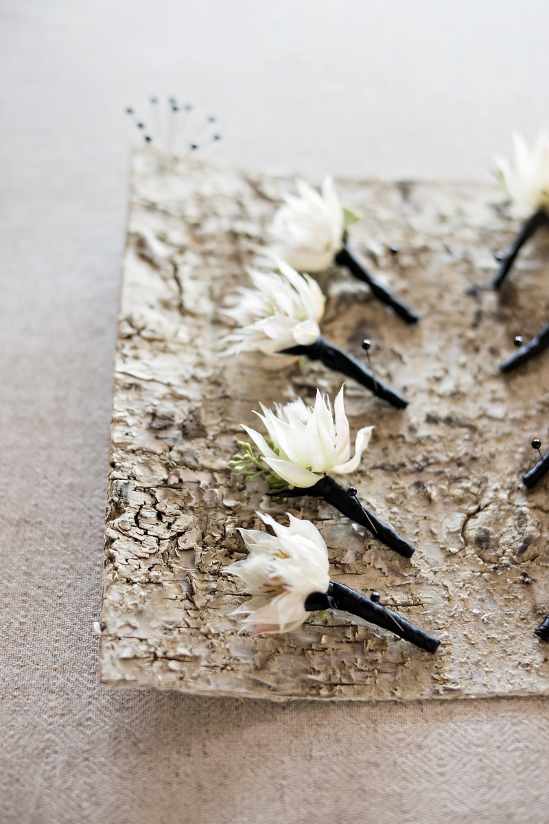 White, Single Flower Boutonnieres
Photography: Laurie Bailey Photography
Read More:
http://www.insideweddings.com/weddings/oceanfront-wedding-ceremony-classic-romantic-ballroom-reception/854/ white single flower boutonnieres greenery black fabric wrapped around pins