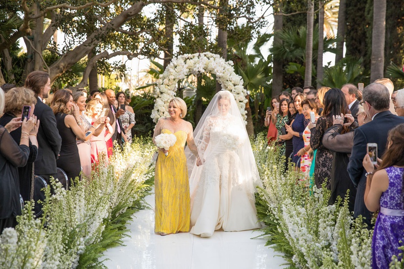 Bride with Mother in Marigold Gown
Photography: Duke Photography
Read More:
http://www.insideweddings.com/weddings/luxurious-alfresco-ceremony-ballroom-reception-in-beverly-hills/1161/ Bride in long sleeve wedding dress and veil with mother of bride in illusion neckline yellow dress