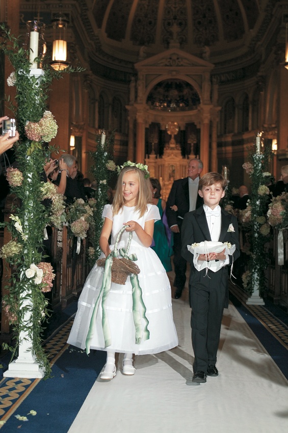 Flower Girl and Ring Bearer Attire
Photography: Gruber Photographers
Read More:
http://www.insideweddings.com/weddings/english-garden-inspired-fall-wedding-in-new-york-city/210/ Cute boy and girl walking down church aisle