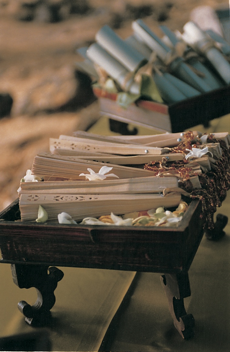 Paper Fans and Programs
Photography: David Michael Photography
Read More:
http://www.insideweddings.com/weddings/tropical-seaside-wedding-in-lanai-hawaii/60/ wedding programs and paper fans displayed in wooden boxes