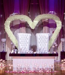 Sweetheart Table with Heart-Shaped Flowers
Photography: Brian Jarreau Photography
Read More:
http://www.insideweddings.com/weddings/alfresco-ceremony-fairy-tale-wedding-reception-with-lavish-decor/1227/ ashley alexiss wedding reception sweetheart table white tufted throne chairs white flower hearts
