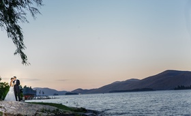 Couple by Lake at Sunset
Photography: Amy Anaiz Photography
Read More:
http://www.insideweddings.com/weddings/lakeside-wedding-with-blue-details-in-upstate-new-york/1140/ bride and groom at shore of lake george, sunset wedding photos on the lake