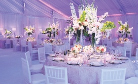 Lavender Reception Lighting
Photography: Gruber Photographers
Read More:
http://www.insideweddings.com/weddings/lavender-hued-tented-reception-in-small-town-massachusetts/180/ Indoor reception with drapery and pink and purple lighting