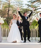 Bride and Groom Celebrate
Photography: Robert Evans Studios
Read More:
http://www.insideweddings.com/weddings/an-austin-texas-lake-house-wedding-with-a-natural-color-palette/568/ Young couple raise hands in celebration after ceremony