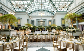 Gold %26 Greenery Reception at Library
Photography: Bob %26 Dawn Davis Photography
Read More:
http://www.insideweddings.com/weddings/classic-wedding-with-gold-details-greenery-at-library-in-chicago/1339/ wedding reception at harold washington library in chicago greenery gold chairs skylight tall ceiling