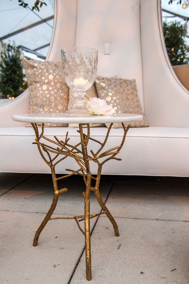 Gold Branch Accent Table
Photography: Carasco Photography
Read More:
http://www.insideweddings.com/weddings/traditional-ceremony-glamorous-garden-inspired-tented-reception/943/ Accent table with gold branches at base around white settee at cocktail hour