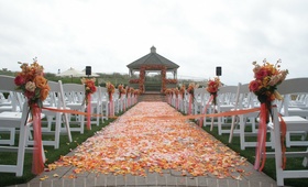 Outdoor Ceremony Decor
Photography: Michelle Walker Photography
Read More:
http://www.insideweddings.com/weddings/colorful-wedding-with-chinese-traditions-at-the-ritz-carlton/241/ Outdoor wedding ceremony decorated with pink, orange, and yellow flowers