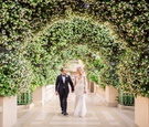Couple Under Tunnel of Greenery
