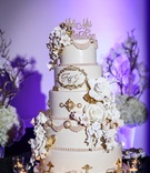 Detailed Five-Tiered Cake
Photography: Amy Anaiz Photography
Read More:
http://www.insideweddings.com/weddings/regal-style-mansion-wedding-with-black-and-gold-color-palette/1046/ pale pink cake with 3D sugar glowers, blush pearls, and gold detail
