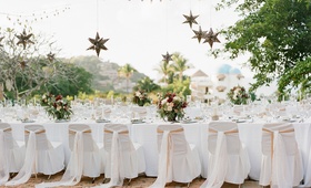 Star-Shaped Lanterns Over Table
Photography: Carrie King Photographer
Read More:
http://www.insideweddings.com/weddings/destination-rehearsal-dinner-and-welcome-party-in-sayulita-mexico/1045/ Wedding rehearsal dinner in Mexico destination welcome party white chair covers star lanterns