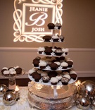 Black and White Cupcake Tower
Photography: Lawrence Crandall Photography
Read More:
http://www.insideweddings.com/weddings/white-black-gold-oceanside-wedding-in-california/309/ Sprinkles cupcakes and stephanotis on cake stand