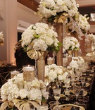Centerpieces of Varying Heights
Photography: Kortnee Kate Photography
Read More:
http://www.insideweddings.com/weddings/glitzy-glamorous-wedding-with-black-gold-palette-in-cincinnati/1056/ glitzy gold centerpieces, wedding king's table with varying heights