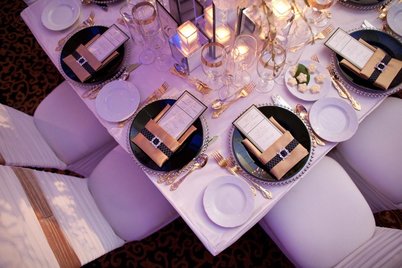 Place Settings
Photography: Josh Lynn Photography
Read More:
http://www.insideweddings.com/weddings/purple-white-gold-new-jersey-celebration/339/ Wedding reception place settings with silver beaded chargers, black plates, and gold napkins