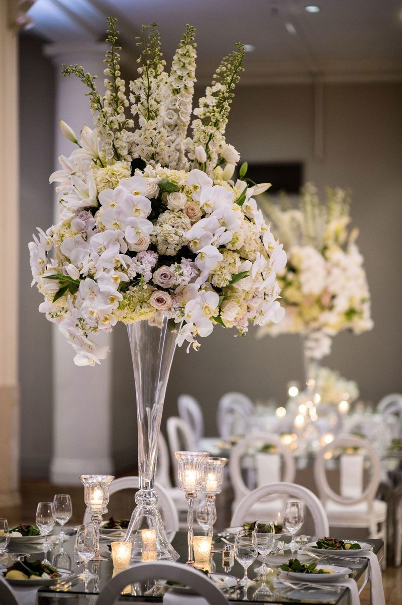 Tall Centerpiece with Lilies %26 Orchids
Photography: Chris Bailey Photography
Read More:
http://www.insideweddings.com/weddings/modern-elegant-ballroom-wedding-with-white-flowers-in-houston/1246/ wedding reception centerpiece tall mirror table orchid purple lavender rose hydrangea lily flowers