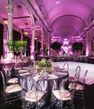 Satin Linens %26 Clear-Backed Chairs
Photography: Callaway Gable
Read More:
http://www.insideweddings.com/weddings/modern-in-the-round-ceremony-whimsical-garden-inspired-reception/1155/ Wedding reception vibiana white dance floor purple lighting linens greenery centerpiece modern chair