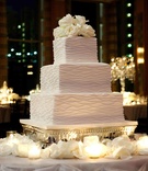 Square White Cake
Photography: Bob %26 Dawn Davis Photography
Read More:
http://www.insideweddings.com/weddings/chic-black-white-summer-wedding-in-chicago-illinois/369/ Three layer wedding cake with fresh roses