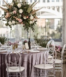 Lavender Table Linens %26 Tall Arrangement
Photography: Belle Ombre Photography
Read More:
http://www.insideweddings.com/weddings/vintage-bohemian-inspired-wedding-on-historic-bridge-in-cleveland/1373/ boho chic wedding reception clear tent velvet purple linen acrylic oval chair tall centerpiece