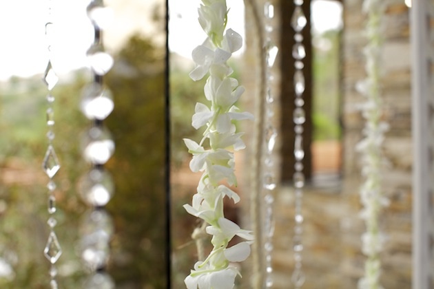 Crystal %26 Orchid Strands
Photography: D. Park Photography
Read More:
http://www.insideweddings.com/weddings/rustic-spring-wedding-in-southern-california/454/ Crystal bead strands and white orchid leis against window