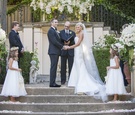 Couple Marrying in Courtyard of Estate