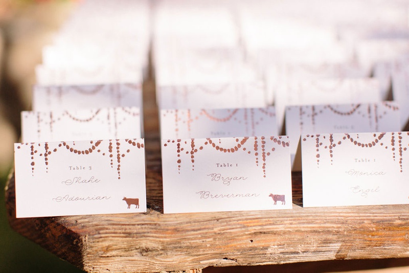 Rustic Wood Escort Card Table
Photography: Ashley Paige Photography
Read More:
http://www.insideweddings.com/weddings/elegant-outdoor-fall-wedding-at-a-rustic-chic-venue-in-malibu/1244/ Minted wedding escort cards with confetti circle motif animal stamps for entree table numbers wood