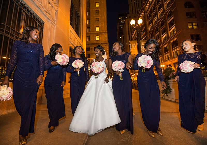 Navy Blue Long-Sleeved Bridesmaid Dresses
Photography: Carasco Photography
Read More:
http://www.insideweddings.com/weddings/church-ceremony-with-nigerian-traditions-chic-ballroom-reception/845/ Bride in wedding dress with bridesmaids in long navy blue dresses with long sleeves or cap sleeves