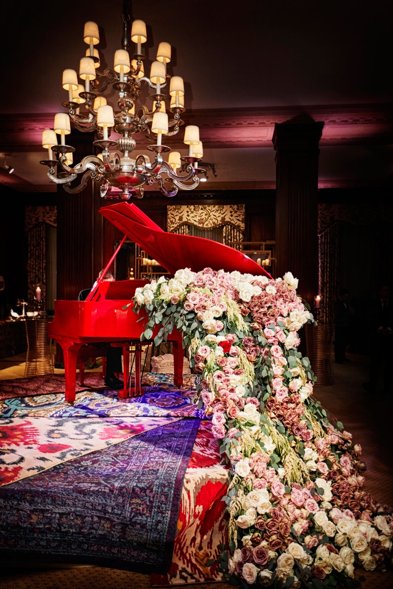 Red Piano with Overflowing Flowers
Photography: KingenSmith
Read More:
http://www.insideweddings.com/weddings/luxurious-wedding-featuring-sentimental-butterfly-decor-in-chicago/1348/ unique wedding decor red grand piano overflowing with pink white roses and greenery layered rugs