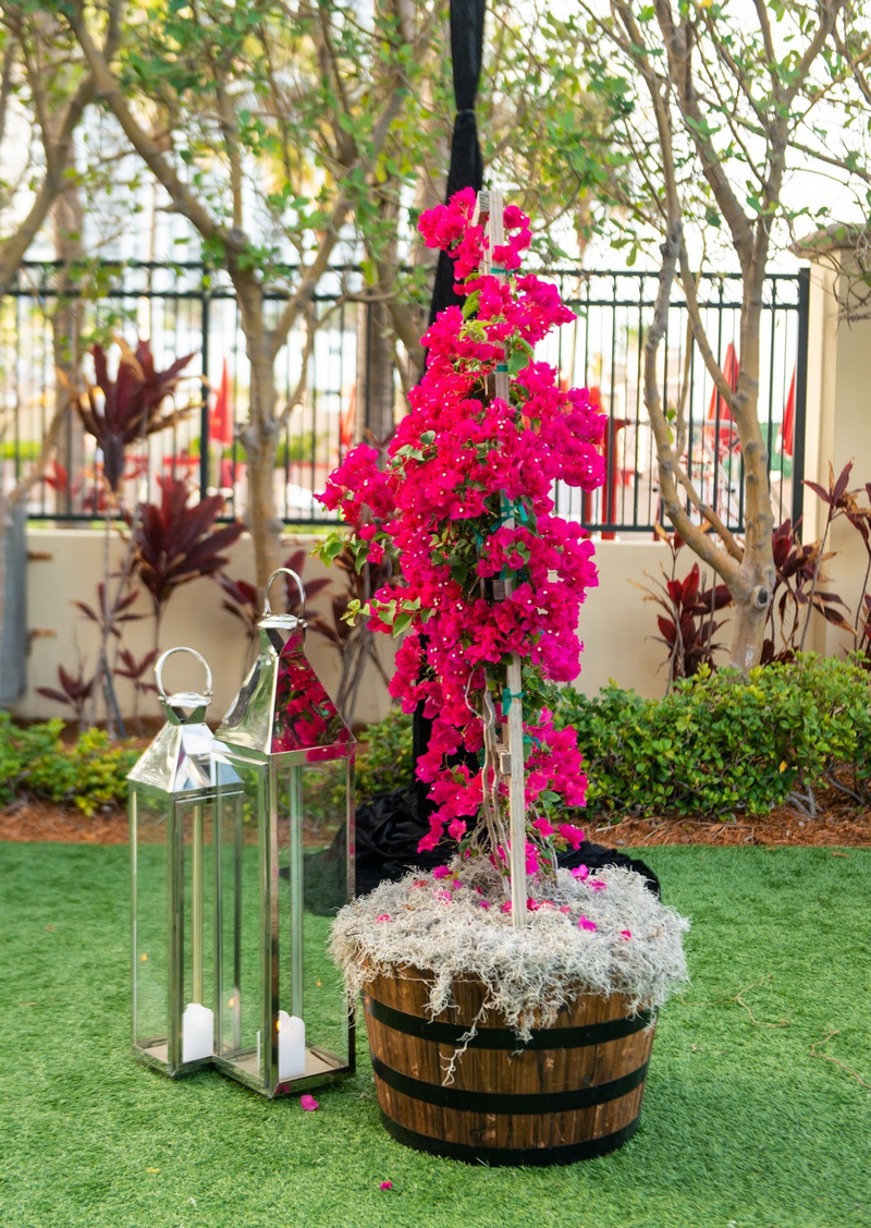 Pink Bougainvillea %26 Lantern Décor
Photography: Suzanne Delawar Studios
Read More:
http://www.insideweddings.com/weddings/intimate-oceanfront-wedding-with-romantic-red-pink-white-palette/1235/ wedding reception tent green lawn wood basket with pink bougainvillea flowers and silver lanterns