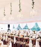 Tent Wedding with Mahogany Farm Table
Photography: Eric Kelley
Read More:
http://www.insideweddings.com/weddings/chapel-ceremony-tented-reception-in-the-south-carolina-lowcountry/1057/ Wedding head table wood x back chairs white linens magnolia leaves greenery crystal chandeliers