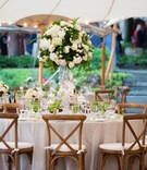 Round Table with Wood Chairs Around
Photography: Images by Berit, Inc.
Read More:
http://www.insideweddings.com/weddings/tented-backyard-wedding-with-equestrian-details-at-a-family-farm/931/ Rustic wedding under tent green glassware colored tall flower arrangement wood chairs white cushions