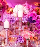 Mercury-Glass Candlesticks
Photography: Bob %26 Dawn Davis Photography
Read More:
http://www.insideweddings.com/weddings/oceanfront-ceremony-opulent-pink-and-metallic-reception/407/ Fuchsia orchids and purple flower wedding centerpiece