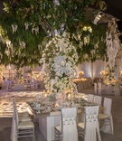 Square Mirror Table %26 Draped Chairs
Photography: Curtis Dahl Photography
Read More:
http://www.insideweddings.com/weddings/spring-outdoor-ceremony-ballroom-reception-with-cultural-elements/1313/ wedding reception ballroom square mirror tablee draped chairs white flowers greenery over chandelier