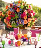 Vibrant Reception Centerpiece %26 Glasses
Photography: Laurie Bailey Photography
Read More:
http://www.insideweddings.com/weddings/outdoor-jewish-ceremony-reception-with-colorful-bohemian-decor/1330/ wedding reception lace linen cane chair green orange purple goblets orange pink green flowers