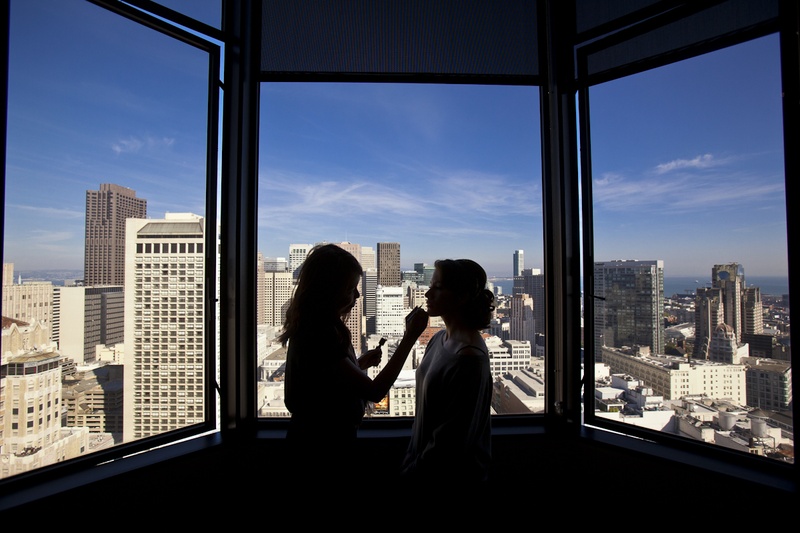 San Francisco Bridal Suite
Photography: Catherine Hall Studios
Read More:
http://www.insideweddings.com/weddings/metropolitan-san-francisco-wedding-at-luxury-hotel/411/ Bride getting makeup on with city skyline silhouette
