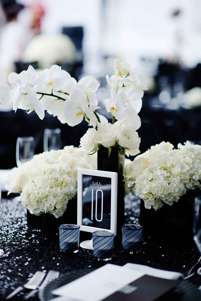 Black %26 White Table Number in White Frame
Photography: Kortnee Kate
Read More:
http://www.insideweddings.com/weddings/black-and-white-modern-wedding-with-unique-details-in-cincinnati/698/ White frame with table number on black stationery at wedding