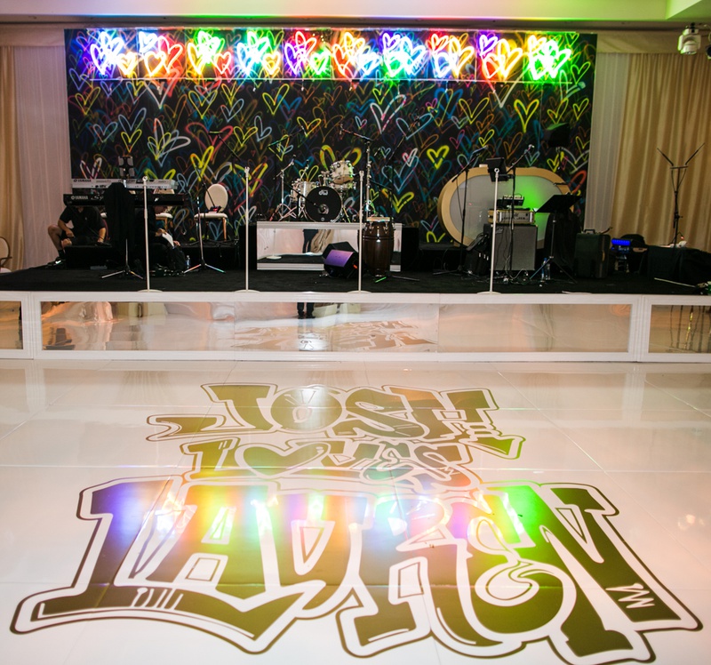 Graffiti-Style Dance Floor %26 Backdrop
Photography: Samuel Lippke Studios
Read More:
http://www.insideweddings.com/weddings/outdoor-jewish-wedding-ceremony-luxe-reception-in-california/1160/ Wedding reception modern band backdrop colorful hearts neon sign graffiti lettering on dance floor