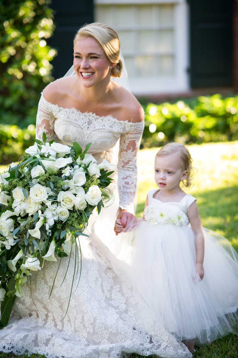 Bride with Cascading Bouquet %26 Flower Girl
Photography: Chris Bailey Photography
Read More:
http://www.insideweddings.com/weddings/southern-at-home-wedding-inspired-by-father-of-the-bride-in-texas/753/ Bride in off the shoulder long sleeve lace Isabelle Armstrong wedding dress with flower girl