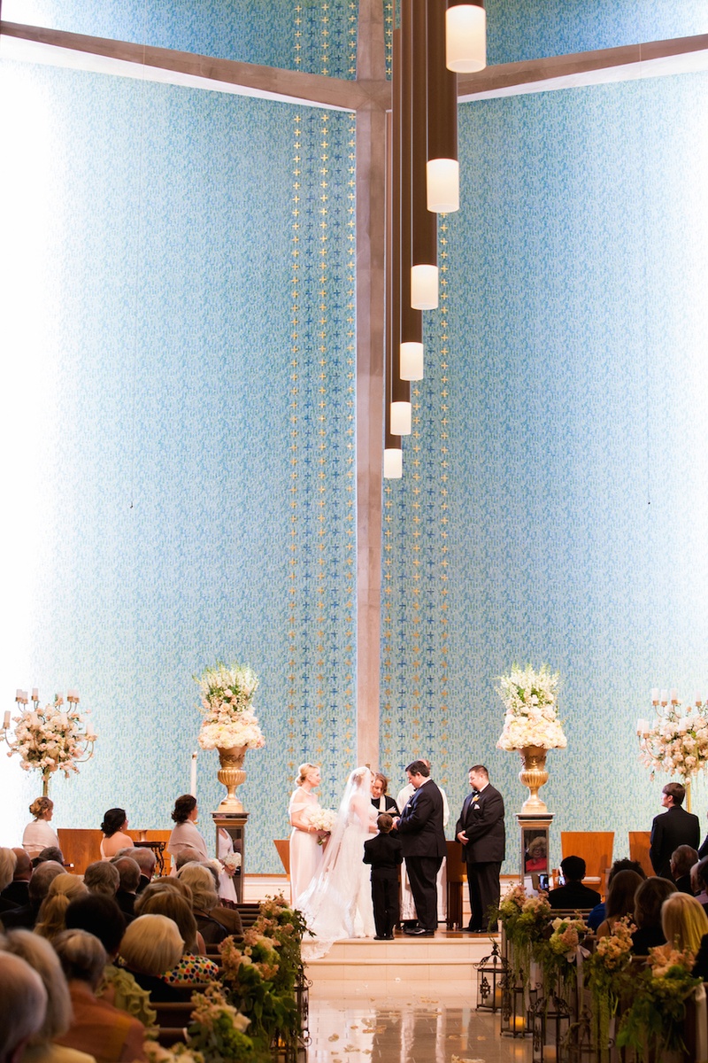 Houston Church Wedding Ceremony
Photography: Michael Carr Photography
Read More:
http://www.insideweddings.com/weddings/traditional-church-ceremony-forest-inspired-reception-in-houston/695/ Bride and groom at altar with tall flower arrangements